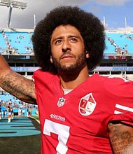 Pro Football QB and Activist Colin Kaepernick (photo via theundefeated.com)