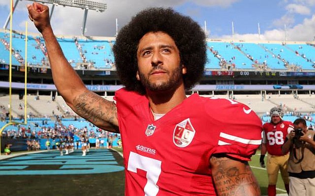 Pro Football QB and Activist Colin Kaepernick (photo via theundefeated.com)