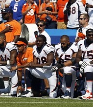 Denver Broncos kneel in protest during the national anthem before their game against the Buffalo Bills. (Photo: Timothy T. Ludwig, USA TODAY Sports)