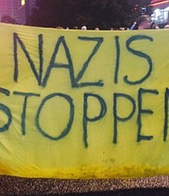 Crowds gathered outside the AfD headquarters in Berlin on Sunday night.