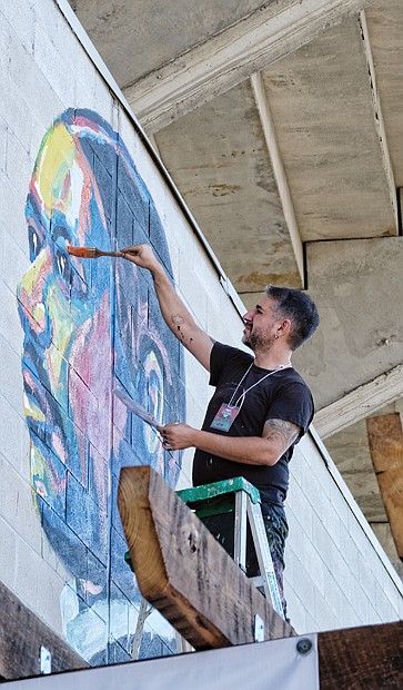 Top right, Noah Scailin creates a portrait of freedom fighter John Mitchell Jr., the late Richmond newspaper editor, civil rights advocate, businessman and politician who led a boycott of the city’s segregated trolley system in 1904. 