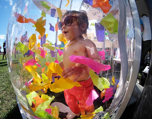 Engulfed in the rainbow
Soren Vox enjoys a blizzard of confetti at VA PrideFest 2017 last Saturday at Brown’s Island in Downtown. The annual event is the largest celebration of the LGBTQ community in Virginia. Please see more photos, B2.