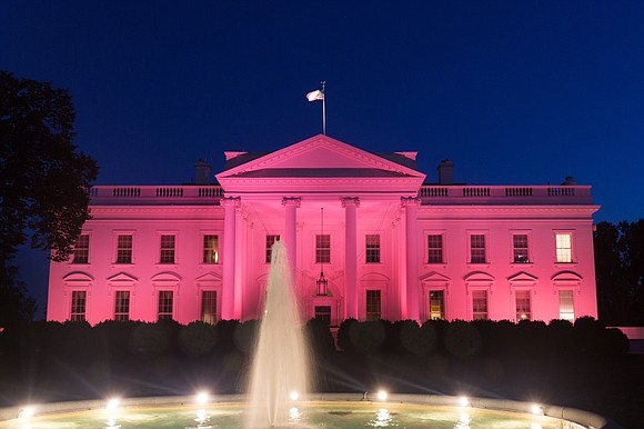 The White House is illuminated in pink in honor of National Breast Cancer Awareness Month, Sunday, October 1, 2017, in …