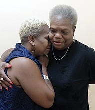 Bonnie L. Davis shares a hug with her biological mother, Sheila Dean Richardson, during an interview last week at the Free Press. They reconnected five decades after Ms. Davis was adopted shortly after her birth in Kentucky.