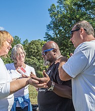 United in prayer //
A coalition of groups welcomed the homeless and others last Saturday to a communitywide faith event, Cookouts for Christ, on Willis Road in South Side. The free event, which featured food and music, also offered testimony by ministry leaders of how Christ turned their lives around from drugs, hopelessness and despair. Joining in prayer at the cookout are, from left, Beth Hextall; Sondra Stephens; Marvin Williams, associate pastor with Grace Alive Ministries; and Jamie Lombardo. The event was sponsored by Christina Perera Ministries in partnership with Harvest Renewal, Dwelling Place and A Place of Miracles Café.
