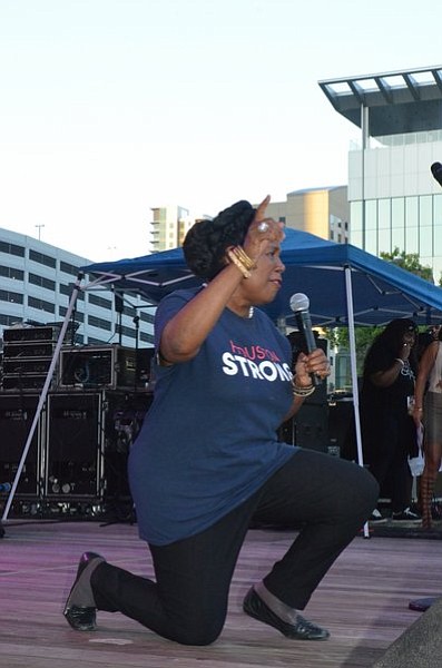 Congresswoman Sheila Jackson Lee taking a knee at the 2017 Houston Black Heritage Fest