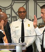 Mayor Sylvester Turner swearing in Samuel Pena as the Houston Fire Department Chief