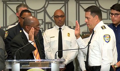 Mayor Sylvester Turner swearing in Samuel Pena as the Houston Fire Department Chief