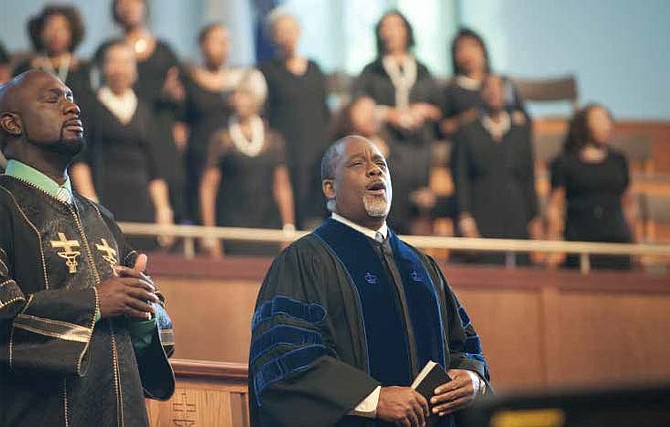 In A Question of Faith, GregAlan Williams portrays Farnsworth Newman, a retiring pastor who transitions from leading his flock to leading his family as a moral compass and voice of wisdom.