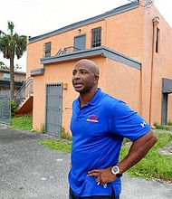In a Sept. 29, 2017 photo, Miguel Pilgram stands outside of the property in the 1400 block of Sistrunk Boulevard in Fort Lauderdale that he plans to transform into a blues club. Pilgram won a $52 million lottery in Miami-Dade seven years ago. He’s set his sights on Sistrunk Blvd., buying a piece of land and preparing to purchase another. He says he feels a moral obligation to invest in the black community, which has a rich history of activism and passion. (South Florida Sun-Sentinel via AP Mike Stocker)