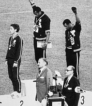 Tommie Smith and John Carlos protest at the 1968 Summer Olympics (photo via vibe.com)