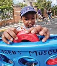 Festival fun //
Jackson Daniel plays a giant game of Connect 4 at the 2nd Street Festival in Jackson Ward last Saturday. The weekend festival showcased various musical genres, foods, local vendors and artists. Please see more photos on B3.