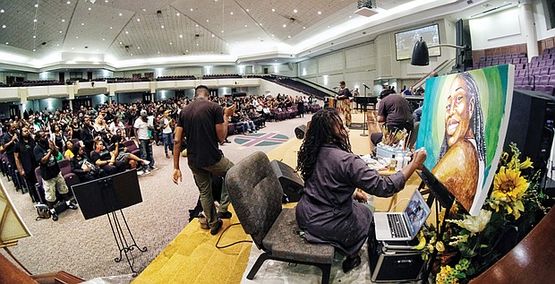 Reshada Pullen-Jireh paints a portrait of Lorna Pinckney as hundreds of friends and relatives celebrate her life Tuesday evening at St. Paul’s Baptist Church on Creighton Road. 