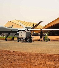 A rare look at a MQ-9 Reaper as it is prepped for flight outside of its hanger. "This aircraft provides very unique capabilities that apply very well in Africa," says US Air Force Col. John Meiter.  "It brings a lot of information gathering capabilities and has very long endurance. We had a period several months ago where this was in the air longer than it was on the ground.
Source:	Brent Swails/CNN