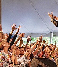 Folk Festival turns up lively music, crowd // Memphis soul singer Don Bryant, bottom right, raises the roof for a cheering crowd.