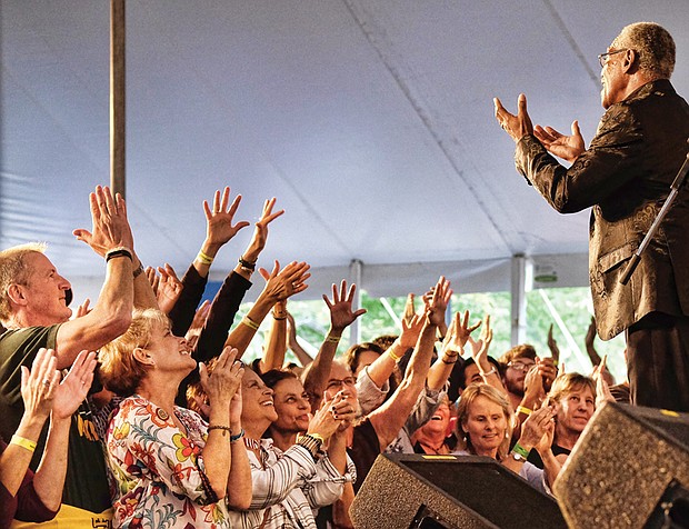 Folk Festival turns up lively music, crowd // Memphis soul singer Don Bryant, bottom right, raises the roof for a cheering crowd.