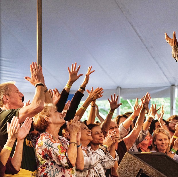 Folk Festival turns up lively music, crowd // Memphis soul singer Don Bryant, bottom right, raises the roof for a cheering crowd.