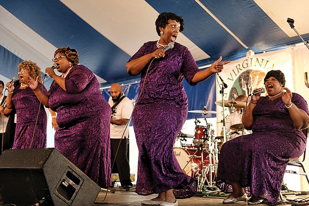  Folk Festival turns up lively music, crowd // The Legendary Ingramettes, below center, rouse the audience and warm the soul with their gospel sounds. 