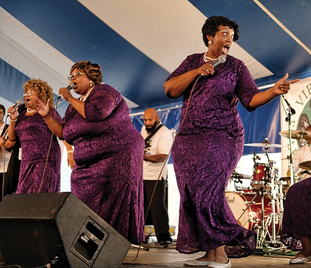  Folk Festival turns up lively music, crowd // The Legendary Ingramettes, below center, rouse the audience and warm the soul with their gospel sounds. 
