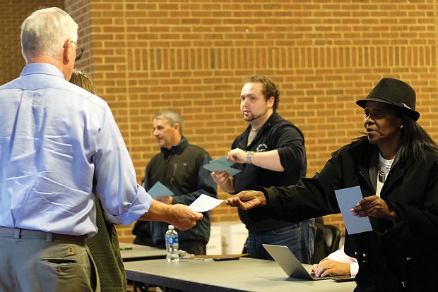 Got the blue ticket //
Volunteers distribute tickets Tuesday at the Richmond Coliseum for the Democratic campaign rally Thursday in Richmond featuring former President Obama. Mr. Obama was to stump for Ralph Northam, the Democratic nominee for governor, and his ticket-mates, Justin Fairfax, who is seeking to become the next lieutenant governor, and Mark Herring who is seeking re-election as attorney general. The rally location: The Greater Richmond Convention Center in Downtown. Mr. Obama was expected to appear around 7 p.m. at the event.      