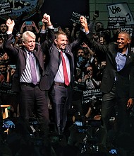 Former President Barack Obama joins the Virginia Democratic ticket on stage at the Greater Richmond Convention Center on Oct. 19 to rally the troops for the upcoming election. They are, from left, lieutenant governor candidate Justin Fairfax; Attorney General Mark Herring, running for re-election; and gubernatorial candidate Ralph S. Northam, the current lieutenant governor.