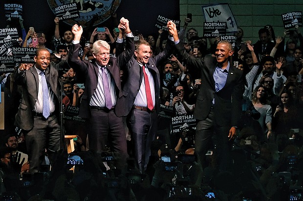 Former President Barack Obama joins the Virginia Democratic ticket on stage at the Greater Richmond Convention Center on Oct. 19 to rally the troops for the upcoming election. They are, from left, lieutenant governor candidate Justin Fairfax; Attorney General Mark Herring, running for re-election; and gubernatorial candidate Ralph S. Northam, the current lieutenant governor.