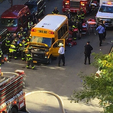 After crashing the truck into a school bus, the suspect exited the vehicle while displaying imitation firearms and was shot in the abdomen by a police officer, according to the NYPD./ Source:	Paul Moses
