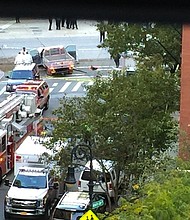 After crashing the truck into a school bus, the suspect exited the vehicle while displaying imitation firearms and was shot in the abdomen by a police officer, according to the NYPD/Source:	Paul Moses