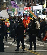 NYPD line the Halloween Parade route in New York