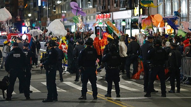NYPD line the Halloween Parade route in New York
