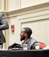 Charlottesville Vice Mayor Wes Bellamy, left, shares a laugh before speaking at the state NAACP Youth and College Division Leadership Breakfast on Sunday with Montae Taylor, the division’s new state president, and Danyelle Honor, president of the University of Virginia NAACP chapter.