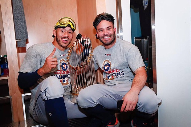 Carlos Correa and José Altuve celebrate the World Series win/Houston Astros' Facebook
 