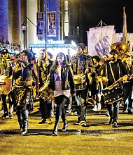 
Costumed revelers head toward Oregon Hill on Tuesday night during the 12th Annual Halloween Parade. All The Saints Theater Company, led by Lilly Lamberta, staged the satirical event. This year’s theme: “Funeral for the Confederacy.” The parade featured puppets representing abolitionists Harriet Tubman and Frederick Douglass and civil rights activist Angela Davis. The parade also included a tribute to Black Lives Matter. The parade drew about 2,000 people and promotes fun while taking a poke at racism and bigotry. 