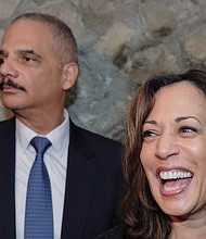 
Former U.S. Attorney General Eric Holder and U.S. Sen. Kamala Harris of California greet the crowd Sunday as they stump in Richmond for Virginia’s Democratic ticket. 