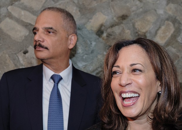 
Former U.S. Attorney General Eric Holder and U.S. Sen. Kamala Harris of California greet the crowd Sunday as they stump in Richmond for Virginia’s Democratic ticket. 