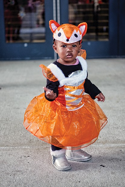 Trick or treat //
Tayarie Johnson, 1, is dressed for the occasion Tuesday in her fox costume for the annual Halloween party hosted by Richmond state Sen. Jennifer McClellan at the Siegel Center on the Virginia Commonwealth University campus.  