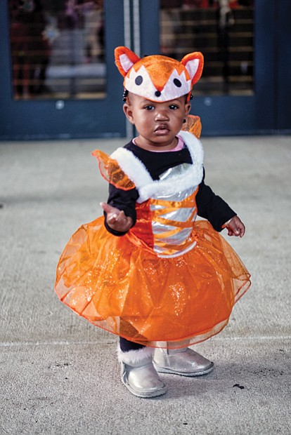 Trick or treat //
Tayarie Johnson, 1, is dressed for the occasion Tuesday in her fox costume for the annual Halloween party hosted by Richmond state Sen. Jennifer McClellan at the Siegel Center on the Virginia Commonwealth University campus.  