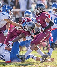 Wild with pride // Fans weren’t let down. The VUU Panthers defeated the Elizabeth City State University Vikings 37-21. Below center, on this play, VUU freshman running back Tabyus Taylor hangs on to the ball as he’s crumpled by the Vikings defense.