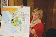 The Albina Vision for the Rose Quarter district is displayed as a fully functioning neighborhood, keeping the sports and entertainment venues, but returning new residential and business-centered blocks.  Zari Santner, a retired Portland Parks Bureau director, is one of the volunteers and advocates behind the grass roots plan.
