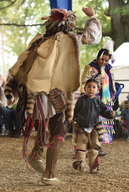 Learning the culture
Quetzal Helme, right, looks to his elder, Tatanka Gibson, for assurance as the youngster performs a traditional Native American dance during the Great American Indian Expo last Saturday at Richmond Raceway. Please see more photos, Page B2. 

