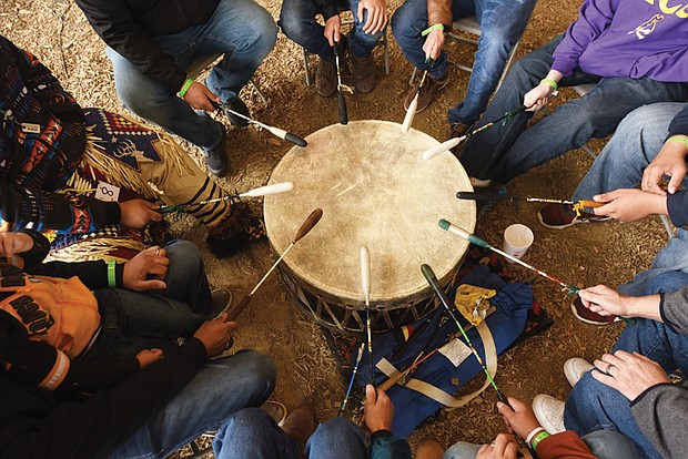 Honoring ancestors and culture// The powwow featured Native American arts and crafts, food and entertainment, including a traditional drum circle, shown below. The two-day event drew people from across the region.
