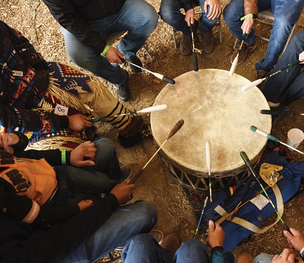 Honoring ancestors and culture// The powwow featured Native American arts and crafts, food and entertainment, including a traditional drum circle, shown below. The two-day event drew people from across the region.
