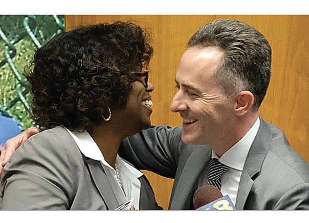 Jason Kamras, the newly selected Richmond Public Schools superintendent, receives a congratulatory hug Monday night from Richmond School Board Chairwoman Dawn Page. Mr. Kamras, who won National Teacher of the Year honors in 2005, is to start Feb. 1. 