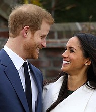 Prince Harry and fiance Meghan Markle make their first public appearance after announcing their engagement on Monday, November 27, 2017.