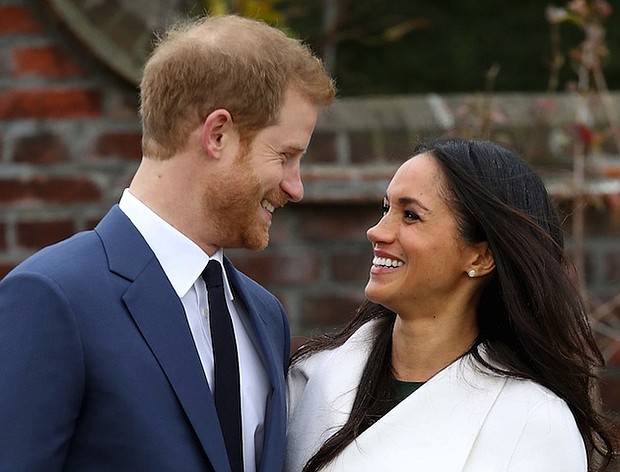 Prince Harry and fiance Meghan Markle make their first public appearance after announcing their engagement on Monday, November 27, 2017.