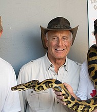 President & CEO of The Cynthia Woods Mitchell Jerry MacDonald and Vice President of Operations Jeff Young pose with Jack Hanna