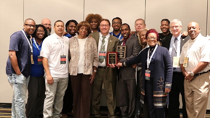 Thornton Township President Frank M. Zuccarelli poses with township elected officials and township staff at the November 2017 Township Officials of Illinois Award Ceremony. Thornton Township received Best Illinois Township Website Award, Best Illinois Social Media Award, and Mr. Zuccarelli received Friends of the Youth Award.  President and Supervisor Frank M.  Zuccarelli standing in the front, center holding one of the awards.
