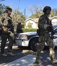  A string of deaths in Tampa's Seminole Heights neighborhood have been linked to each other. FBI and police are seen here in the area. (File Photo)
