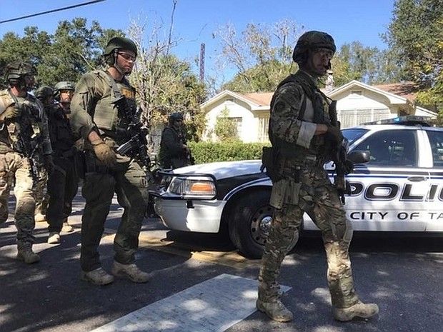  A string of deaths in Tampa's Seminole Heights neighborhood have been linked to each other. FBI and police are seen here in the area. (File Photo)
