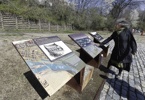  Ana Edwards talks about historical markers at the Lumkin Jail historical site in Shockoe Bottom in Richmond, Va./Steve Helber, AP